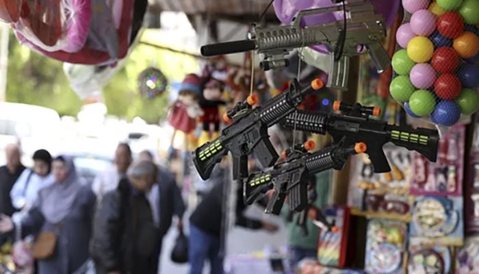 Toy guns put on sale in a market. — AFP/File