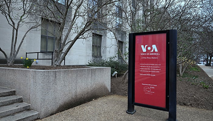 A view of signage at the Voice of America (VOA) building, a day after more than 1,300 of the employees of the media broadcaster, which operates in almost 50 languages, were placed on leave in Washington, DC, on March 16, 2025. — Reuters