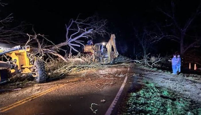 This handout image taken and released by the Missouri State Highway Patrol on March 15, 2025 shows debris on a road in the Bakersfield area, in Ozark County, Missouri, after severe storms hit the area. — AFP