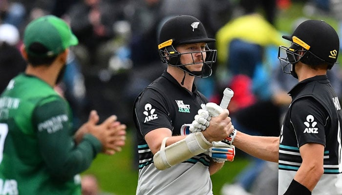 New Zealands Michael Bracewell (C) and Mitchell Hay (R) celebrate their win in the second Twenty20 international cricket match between New Zealand and Pakistan at University of Otago Oval in Dunedin on March 18, 2025.  — AFP