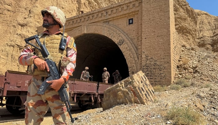 Pakistan army soldiers stand at a tunnel where the Jaffar Express train was attacked by militants, in Bolan, Balochistan, on March 15, 2025. — Reuters