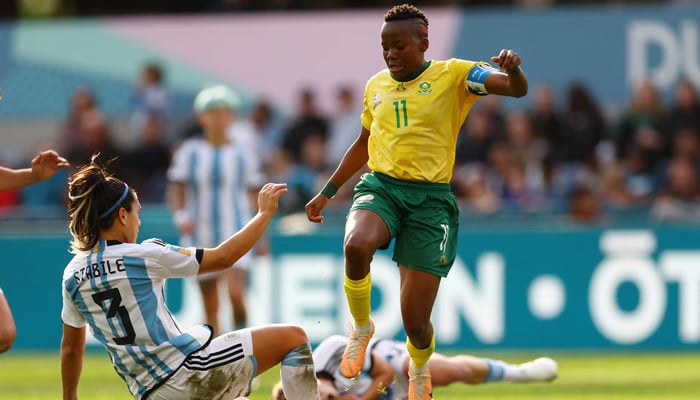 South Africas Thembi Kgatlana in action with Argentinas Eliana Stabile. — Reuters