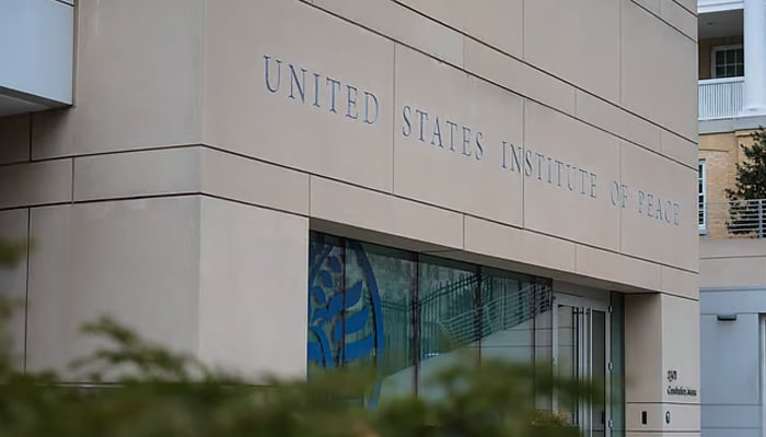 A sign for the United States Institute of Peace (USIP) is seen on itss building headquarters on February 20, 2025 in Washington, DC. — Reuters