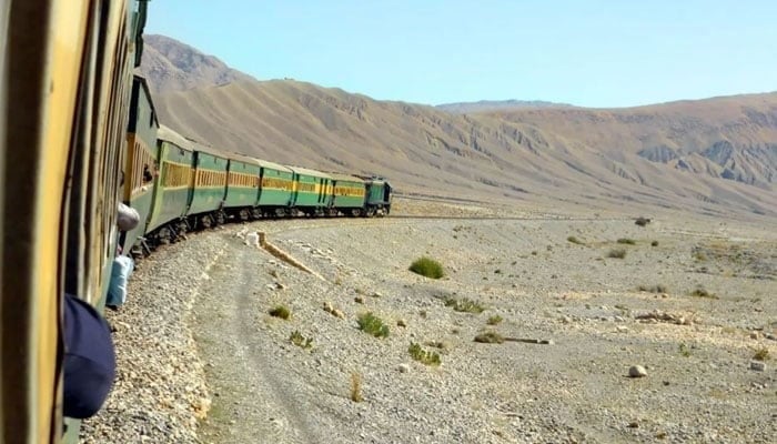 An undated image of a Pakistan Railways passenger train passing through a mountainous terrain in Balochistan. — Pakistan Railways/File