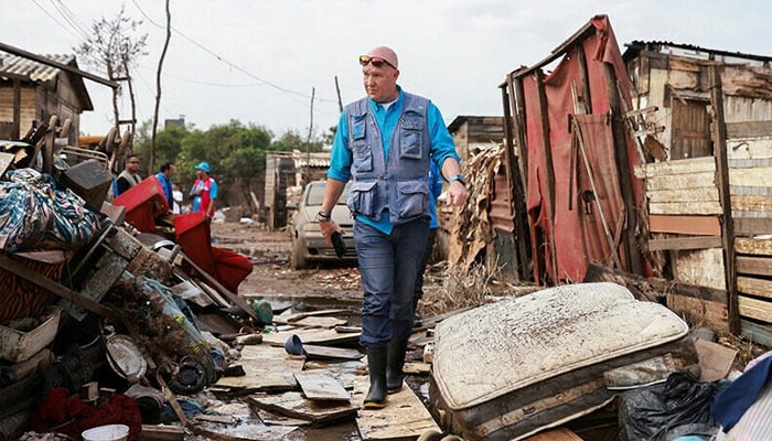 Andrew Harper, climate advisor for the UN refugee agency (UNHCR), looks on during a visit to a neighborhood partially destroyed by the floods that hit Porto Alegre, in the state of Rio Grande do Sul, Brazil on June 23, 2024. — Reuters