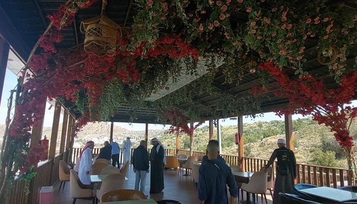 A restaurants seating area is decorated with different types of flowers in Taif, Saudi Arabia. — Reporter