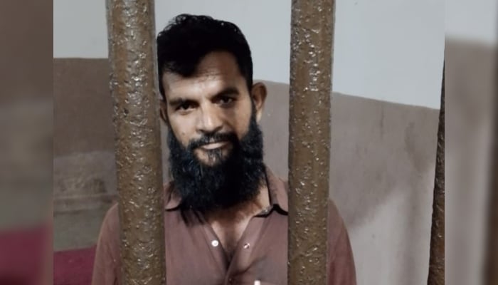 The man arrested for taking illegal parking fees in Saddar area is behind the bars at Preedy police station in Karachi. — Reporter