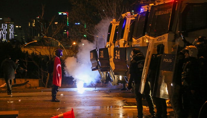 Protester stands firmly in front of the police during a protest by students against the detention of Istanbul Mayor Ekrem Imamoglu, in Istanbul, Turkey, March 21, 2025. — Reuters