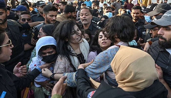 Police personnel detain activists from the Baloch Yakjehti Committee and civil society during a protest demanding the release of Mahrang Baloch, one of Pakistan’s prominent human rights advocates, along with missing Baloch persons, in Karachi on March 24. — AFP